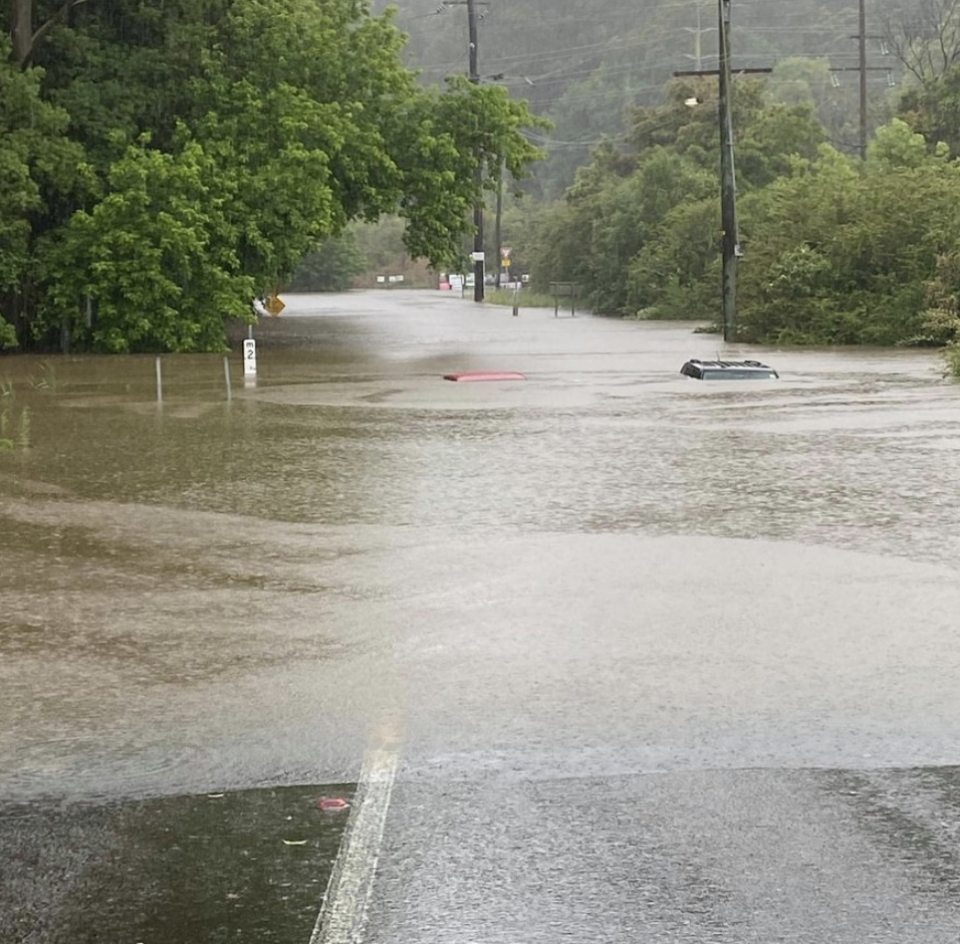 Cars are seen underwater on a road during flash flooding in Ourimbah on the NSW Central Coast. Source: nswincidents