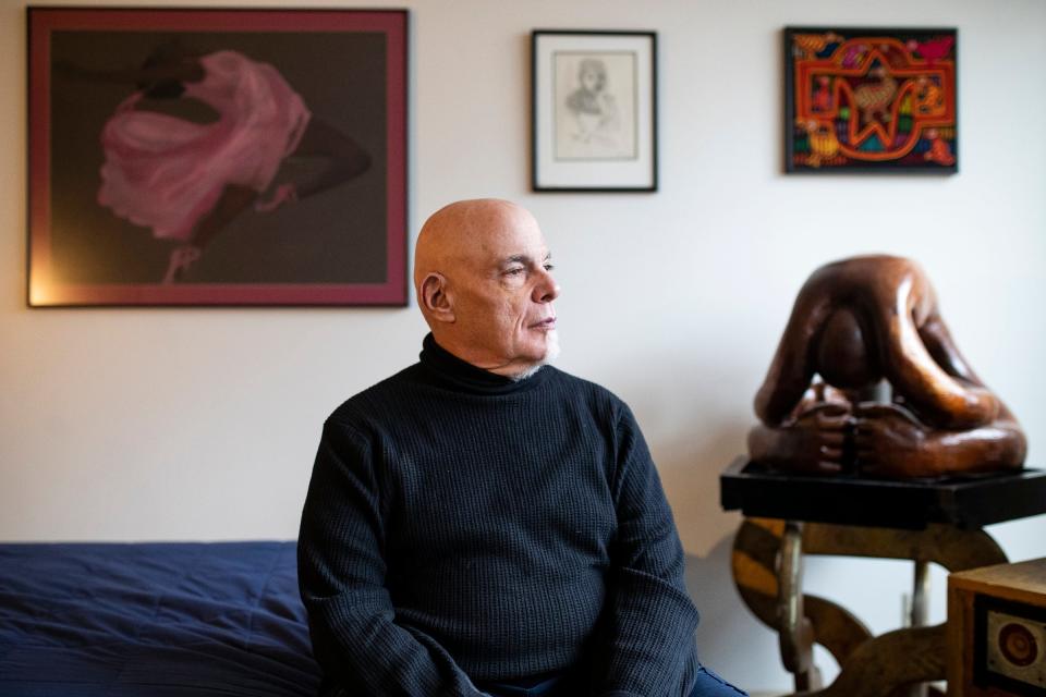 Stephen Handschu next to his sculpture "Terminal Conception" at his apartment in Detroit on Wednesday, Nov. 8, 2023