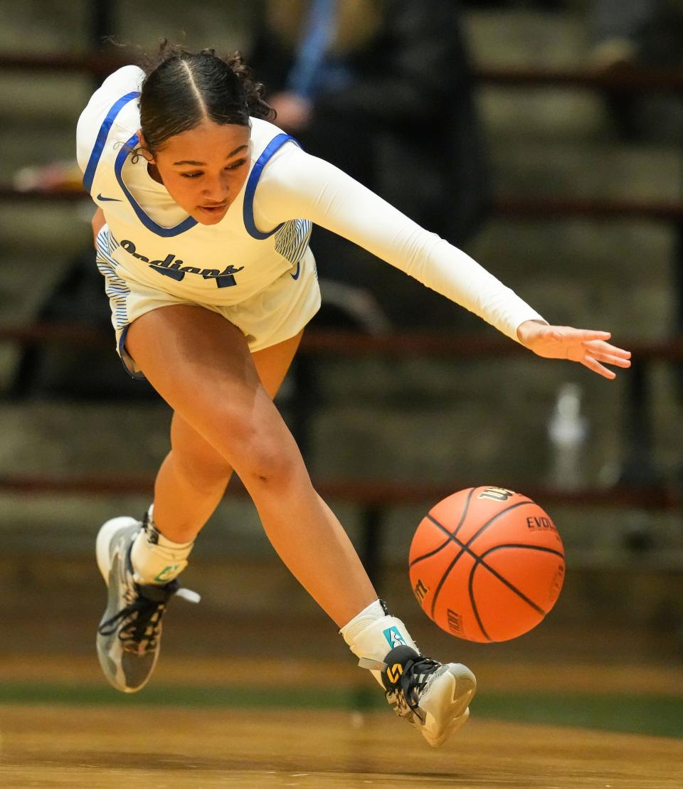 Lake Central's guard Vanessa Wimberly (23) reaches for the ball Thursday, Oct. 5, 2023, during the Hall of Fame Classic girls basketball tournament at New Castle Fieldhouse in New Castle. Lake Central defeated Indian Creek, 51-45.
