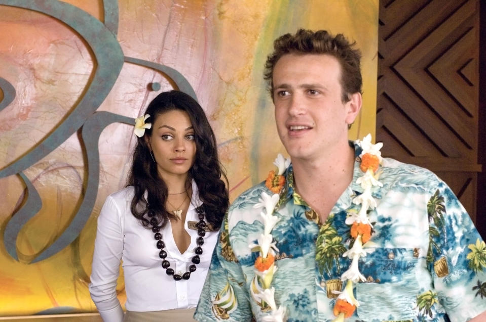 Mila Kunis and Jason Segel wearing tropical clothes