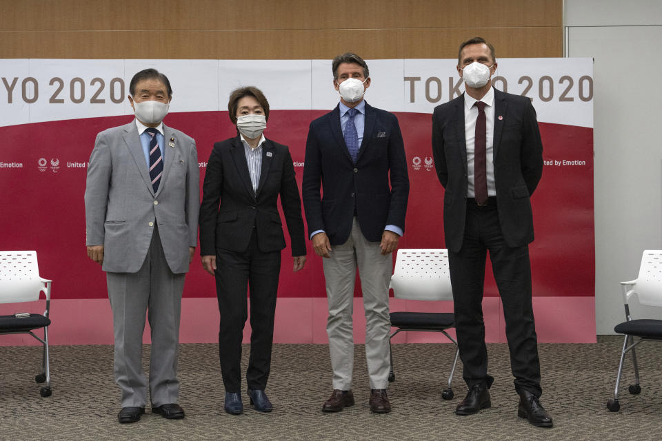 Toshiaki Endo, left, vice president of the Tokyo 2020 Organizing Committee, Seiko Hashimoto, second left, president of the Tokyo 2020 Organizing Committee, Sebastian Coe, third from left, president of World Athletics and John Ridgeon, World Athletics CEO, pose for a photograph ahead of a meeting Friday, May 7, 2021 in Tokyo, Japan. (Carl Court/Pool Photo via AP)