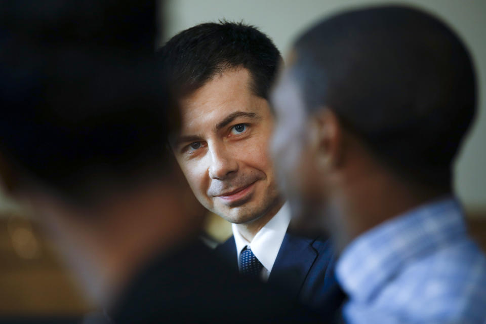 Democratic presidential candidate former South Bend, Ind., Mayor Pete Buttigieg, center, takes park in a roundtable discussing health equity with Stephania Priester, left, and Jalen Elrod, right, Thursday, Feb. 27, 2020, at the Nicholtown Missionary Baptist Church in Greenville, S.C. (AP Photo/Matt Rourke)