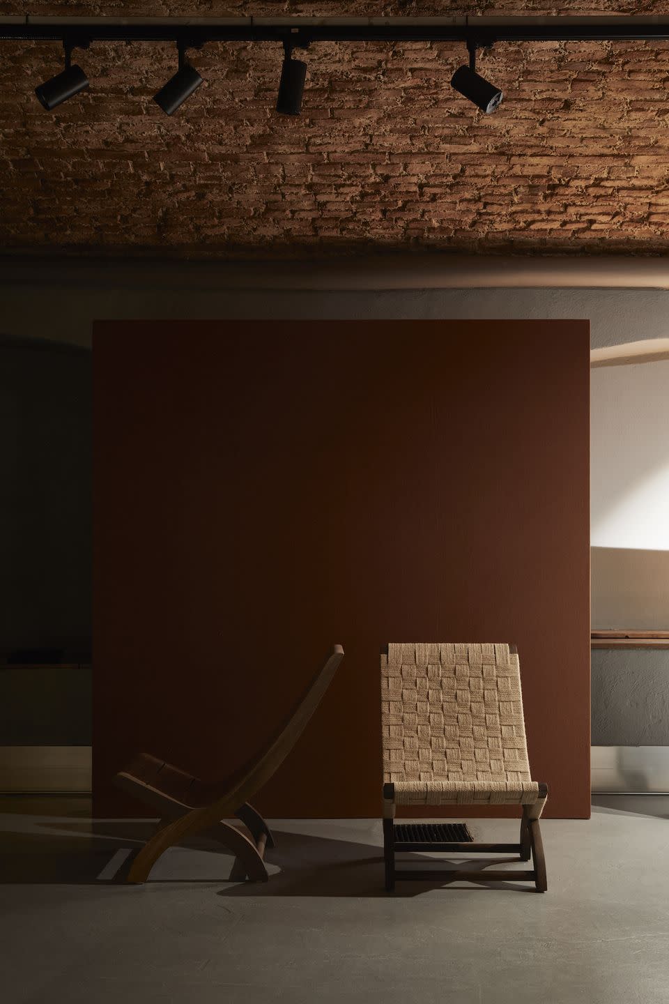 two chairs in front of a wall