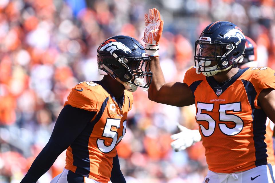 Sep 16, 2018; Denver, CO, USA; Denver Broncos linebacker Von Miller (58) and linebacker Bradley Chubb (55) celebrate a stop in the first quarter against the Oakland Raiders at Broncos Stadium at Mile High. Mandatory Credit: Ron Chenoy-USA TODAY Sports