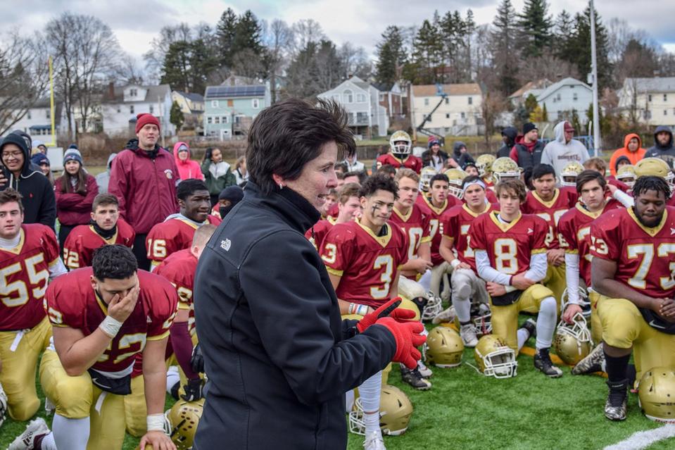 Superintendent Maureen Binienda speaks to players after last November's Thanksgiving Day game between Doherty and Burncoat at Foley Stadium.