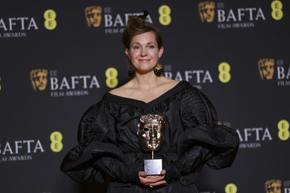 Holly Waddington, winner of the costume design award for 'Poor Things', poses for photographers at the 77th British Academy Film Awards, BAFTA's, in London, Sunday, Feb. 18, 2024. (Photo by Vianney Le Caer/Invision/AP)