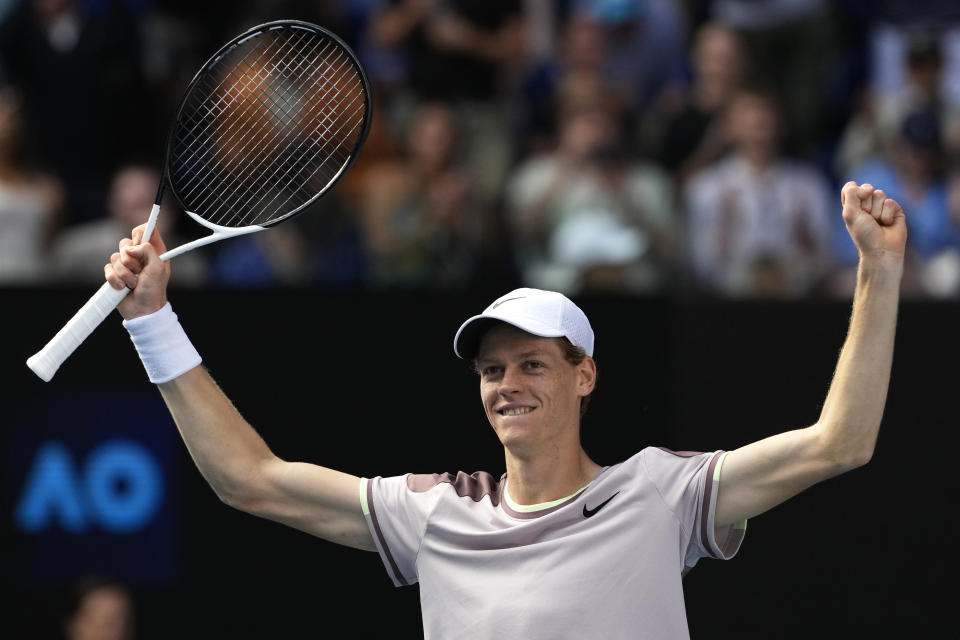 Jannik Sinner of Italy celebrates after defeating Novak Djokovic of Serbia in their semifinal at the Australian Open tennis championships at Melbourne Park, Melbourne, Australia, Friday, Jan. 26, 2024. (AP Photo/Alessandra Tarantino)