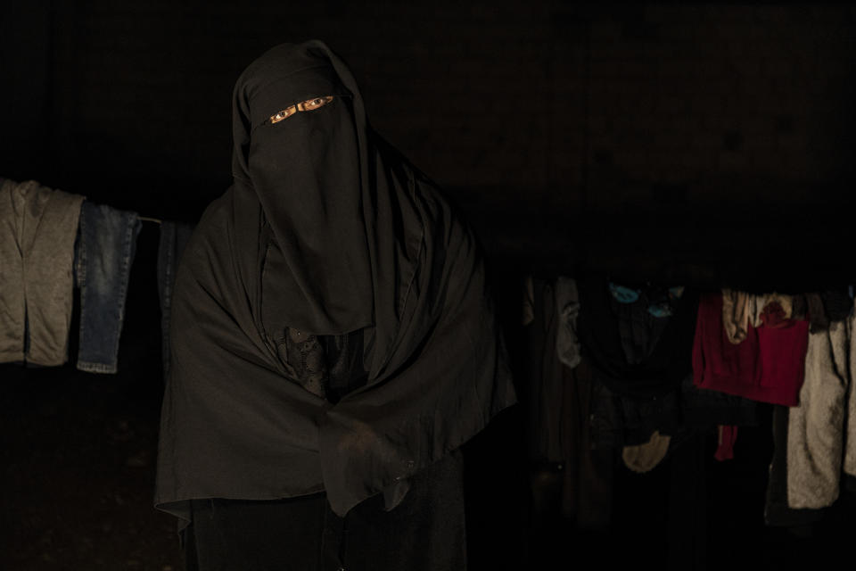 Marwa Ahmad poses for a photo in Raqqa, Syria, Wednesday, Dec. 28, 2022. Ahmad is among tens of thousands of widows and wives of IS militants who were detained in the wretched and lawless al-Hol camp in northeastern Syria after U.S.-led coalition and Syrian Kurdish forces cleared IS from northeastern Syria in 2019. (AP Photo/Baderkhan Ahmad)