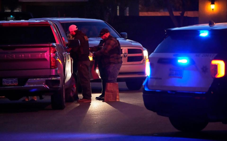 Las Vegas police work near the home of former actor Nathan Lee Chasing His Horse - AP