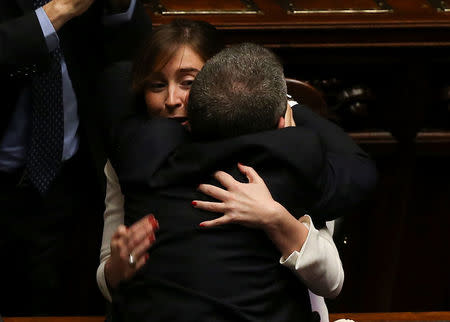 Italian Minister for Constitutional Reforms and Parliamentary Relations Maria Elena Boschi (L) celebrates with Ivan Scalfarotto (R), member of of Democratic Party after the final vote on gay and unmarried civil unions at the Italy's lower house of Parliament in Rome May 11, 2016. REUTERS/Alessandro Bianchi