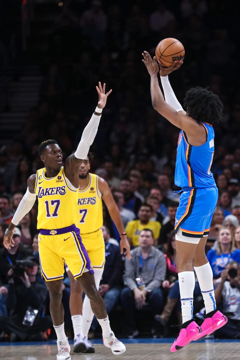 Oklahoma City forward Jalen Williams (8) shoots over Los Angeles guard Dennis Schroder (17) in the first quarter of an NBA game between the Oklahoma City Thunder and the Los Angeles Lakers at the Paycom Center in Oklahoma City on Wednesday, March 1, 2023. 