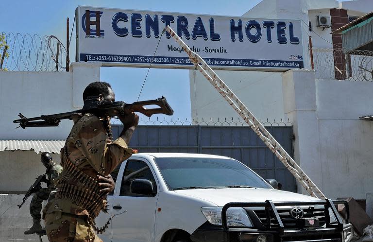 Somali security forces guard the entrance to the Central Hotel, close to the presidential palace in Mogadishu, on February 20, 2015