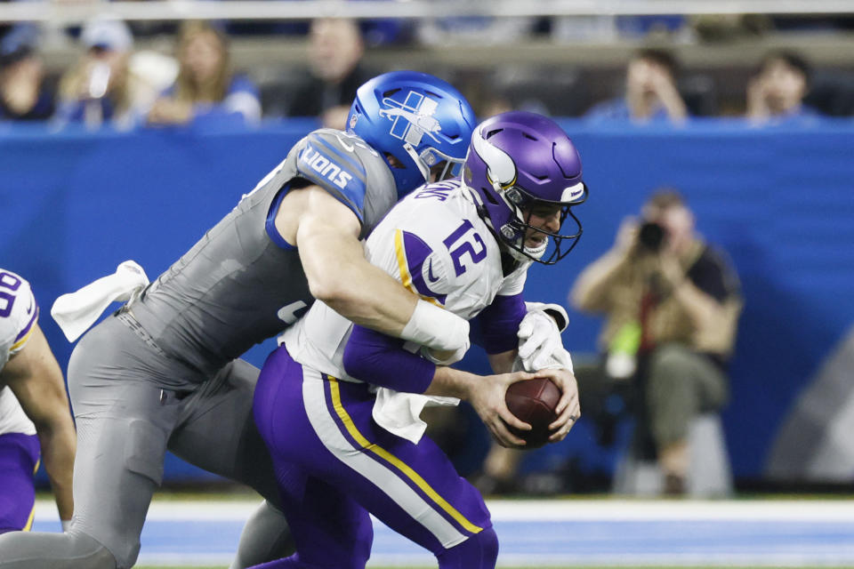 Detroit Lions defensive end Aidan Hutchinson sacks Minnesota Vikings quarterback Nick Mullens (12) during the first half of an NFL football game, Sunday, Jan. 7, 2024, in Detroit. (AP Photo/Duane Burleson)