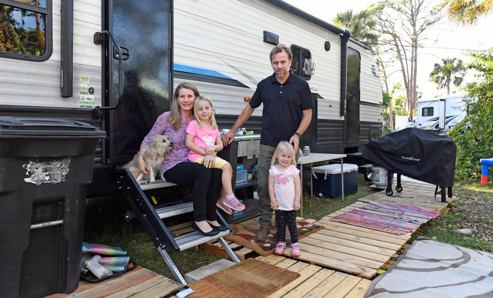 Lindsay Weishaar, a nurse at SMH, and her husband Doug and their two kids, Lilly, 2, Piper, 5, and their eighteen-year-old wonder dog Sandy. They are still living in a state-provided camper behind their house, which was flooded six-months ago during Hurricane Ian.