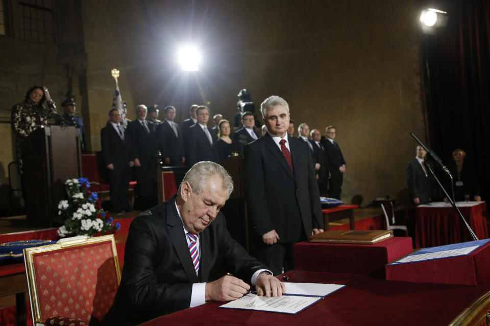 FILE - In this March 8, 2013 file photo, Newly elected Czech President Milos Zeman signs an oath during his inauguration ceremony at the Prague Castle in Prague, Czech Republic. Wednesday, March 8, 2023 marks the final day in office of outgoing Czech President Milos Zeman, with his opponents planning to celebrate. Zeman has polarized the Czechs during his two five-year terms in the normally largely ceremonial post with his support for closer ties with China and by being a leading pro-Russian voice in European Union politics. (AP Photo/Petr David Josek/File)