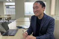 Tokyo city hall official Takuo Takano speaks during an interview with The Associated Press at city hall on June 17, 2024. “Tsukiji is a special place for Tokyo. It’s so close to downtown, yet it’s surrounded by waterways and greenery,” Takano said. (AP Photo/Yuri Kageyama)