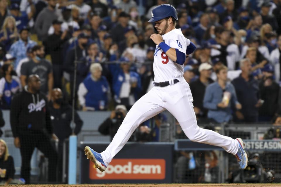 Los Angeles, CA - October 12: Los Angeles Dodgers' Gavin Lux crosses home to score a run.