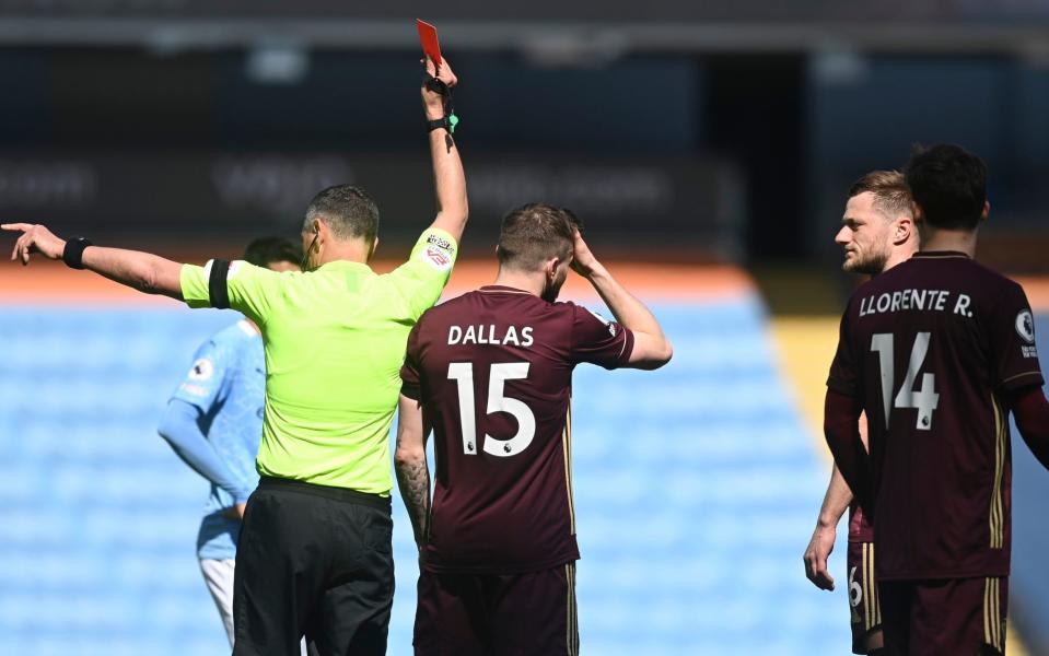 Liam Cooper is shown a red card against Man City - GETTY IMAGES