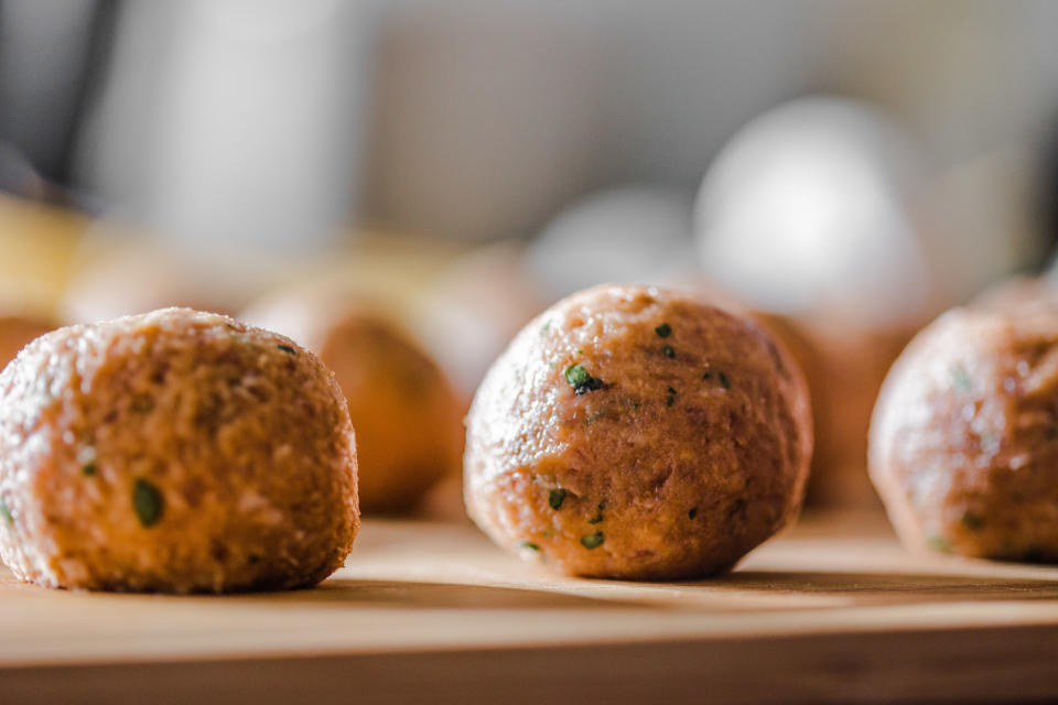 Preparing meatballs.