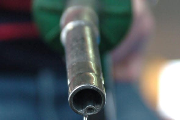 File photo dated 13/09/05 of a person using a petrol pump as British drivers are still facing a huge petrol and diesel  tax burden despite three years of fuel duty freezes, according to the RAC Foundation. PRESS ASSOCIATION Photo. Issue date: Monday March 3, 2014. The UK has the highest rate of diesel tax in Europe while only Sweden imposes a higher petrol tax duty than the UK, the foundation said. Its figures showed that tax accounts for 59% of the price of diesel in the UK, with Sweden (56%) second and Italy (55%) third. As much as 61% of the price of petrol in the UK is down to tax, with Swedes (62%) paying the most in tax and the Netherlands (61%) paying the same. See PA story TRANSPORT Petrol. Photo credit should read: Danny Lawson/PA Wire