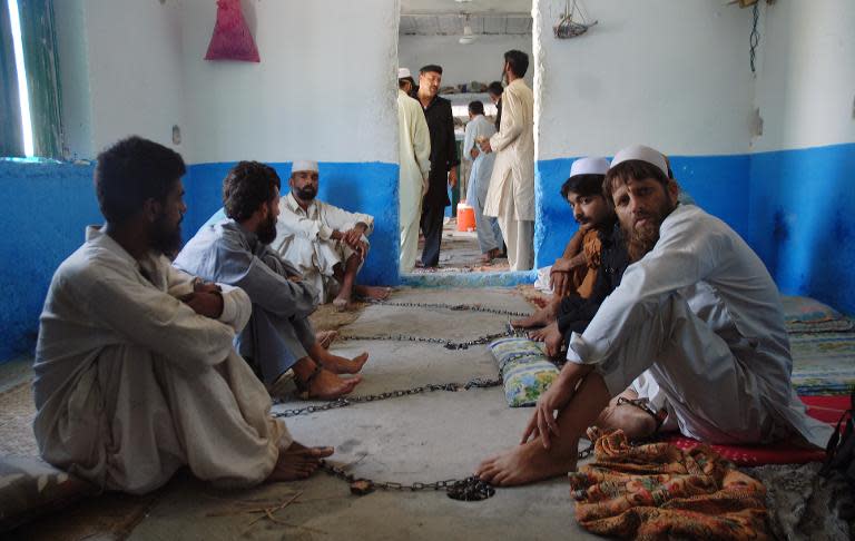 Chained Pakistani drug addicts at a centre in Haripur on July 19, 2014