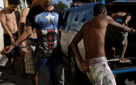 Suspects are arrested after violent clashes with Brazilian Army soldiers after taking a family hostage in Alemao slums complex in Rio de Janeiro, Brazil August 20, 2018. REUTERS/Ricardo Moraes