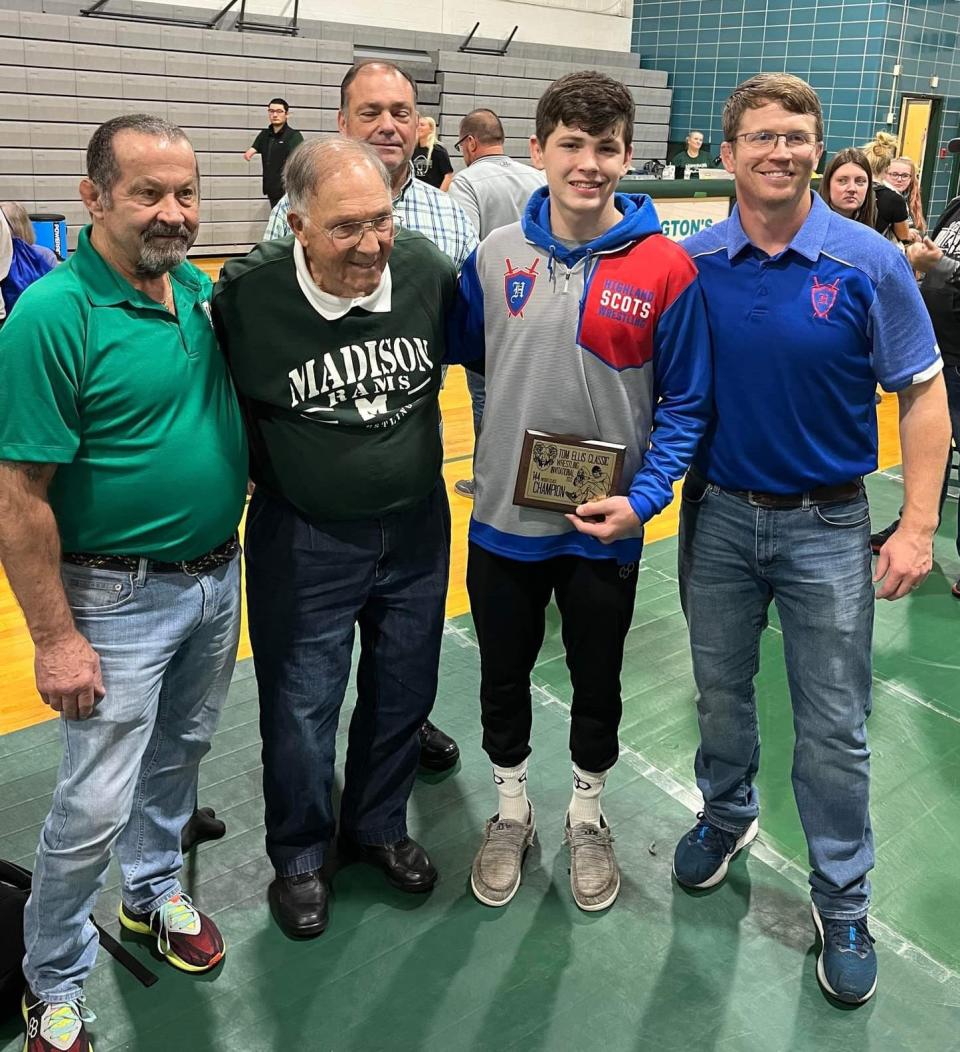 Legendary Madison coach Tom Ellis (second from left) at Madison's Tom Ellis Classic with winning coach Adam Gilmore of Sparta Highland and his son Cael, the 144-pound champ, and (far left) Tim Gilmore, Adam's father and a former wrestler for Ellis at Madison.