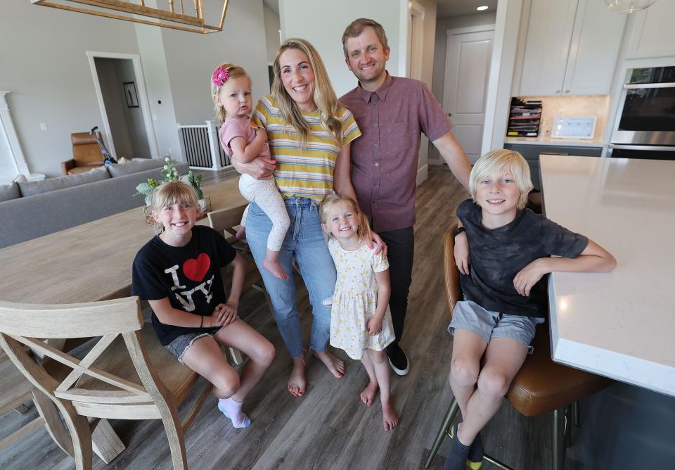 Scott and Heather Evanson stand with their children Millie, Porter, Ruby and Penny at their home in Lehi on Thursday, May 18, 2023. | Jeffrey D. Allred, Deseret News