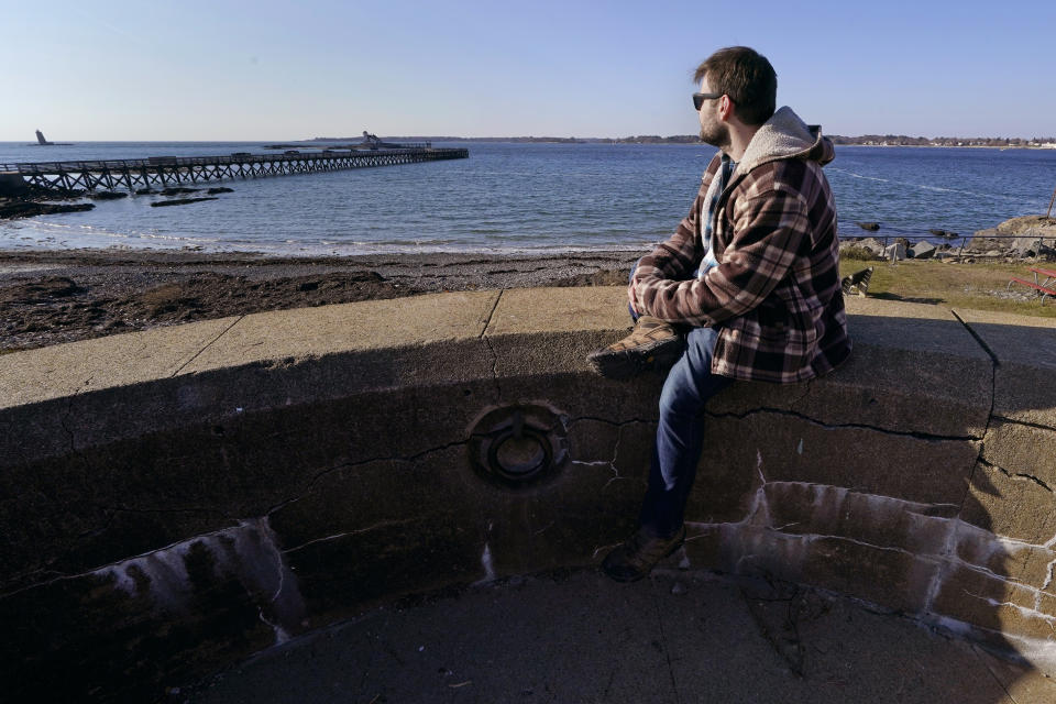 Jacob, an abuse survivor from New Hampshire’s youth detention center, looks out towards the sea at Fort Foster, a place where he finds personal solace, Thursday, Nov. 30, 2023, in Kittery Point, Maine. He says he's frustrated that so few perpetrators have been held accountable. “I am at the point where I want the state to be responsible,” he said. “I want people to know.” (AP Photo/Charles Krupa)