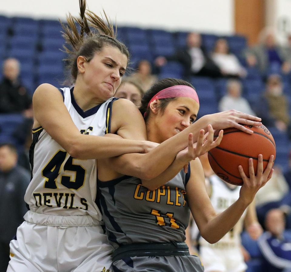 Copley's Emma Beck, right, brings down a rebound against Tallmadge's Isabella Messina during the second half of a basketball game, Saturday, Dec. 4, 2021, in Tallmadge, Ohio.