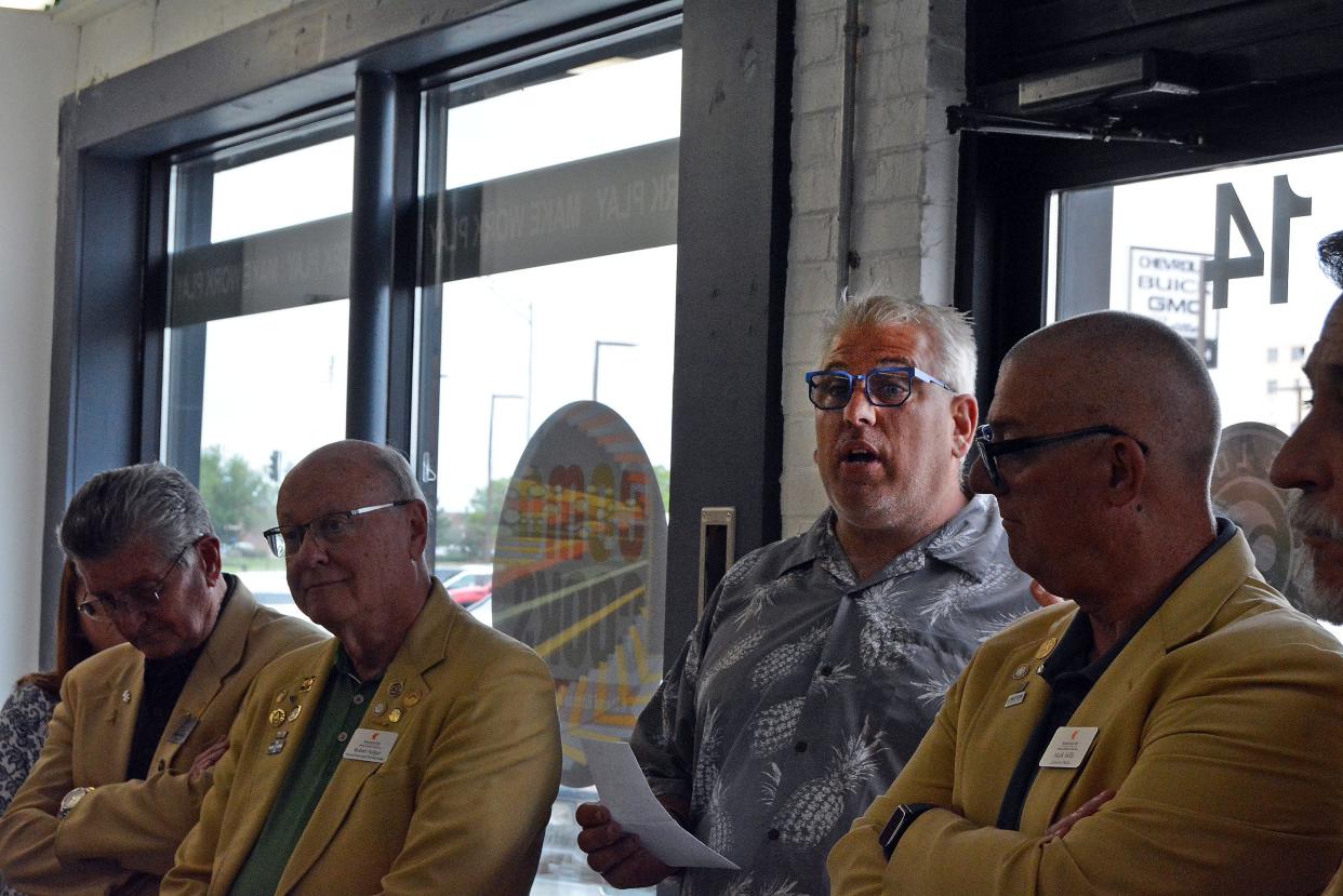 James Roark-Gruender, third from left, The Loop Community Improvement District board president, welcomes Columbia Chamber of Commerce ambassadors and others to the official opening of The Loop's CoMoCooks shared kitchen space at 14 Business Loop 70 E.