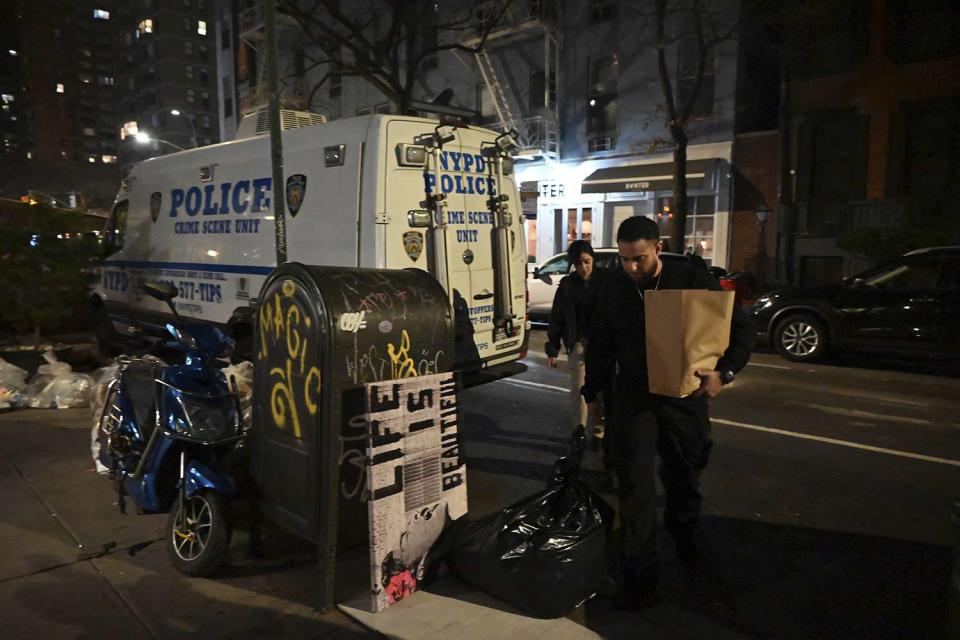 <p>Kyle Mazza/NurPhoto via AP</p> Investigators at the crime scene on March 15, 2024