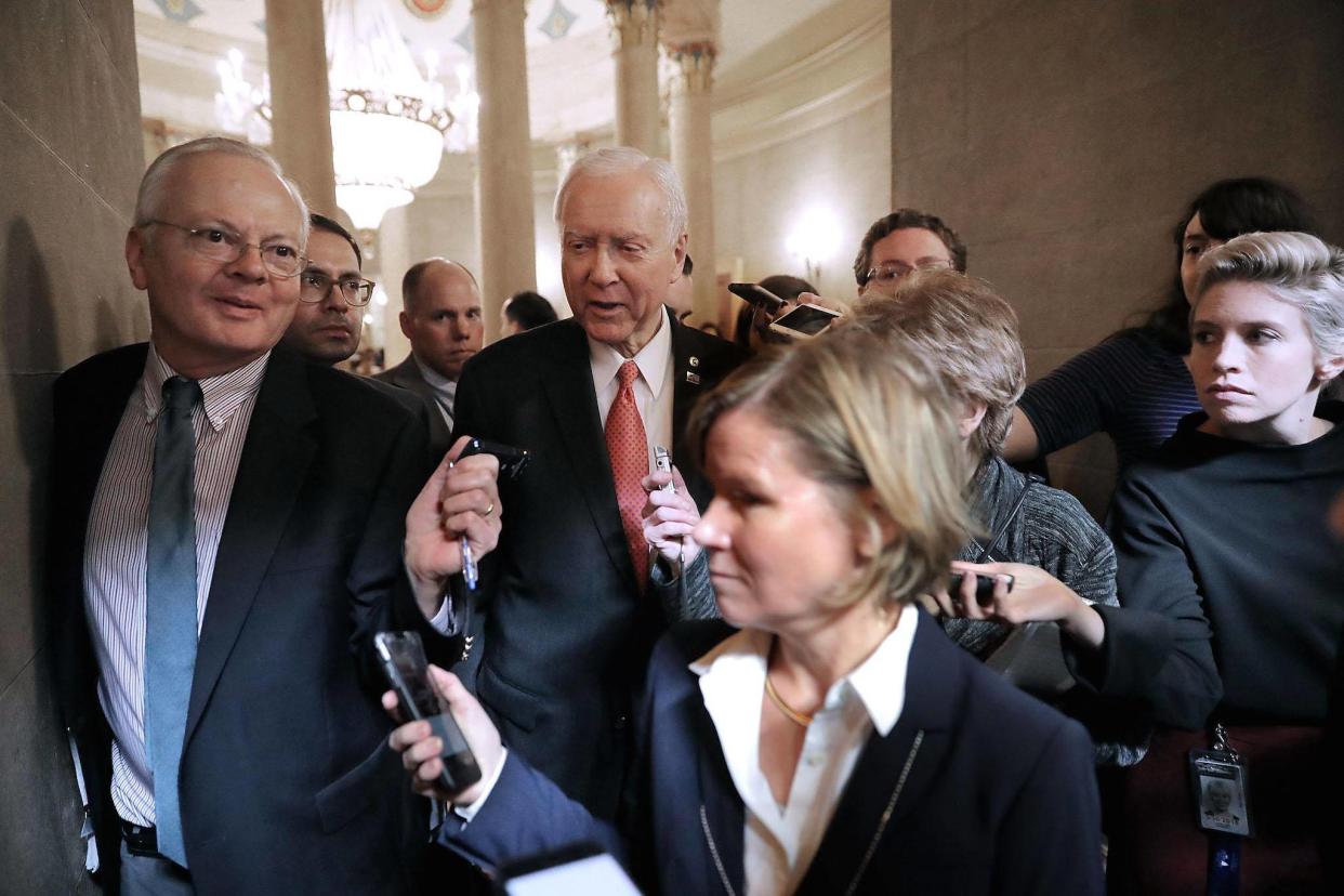 Senate Finance Committee Chairman Orrin Hatch talks with journalists before heading into a tax meeting (Photo by Chip Somodevilla/Getty Images): Getty Images