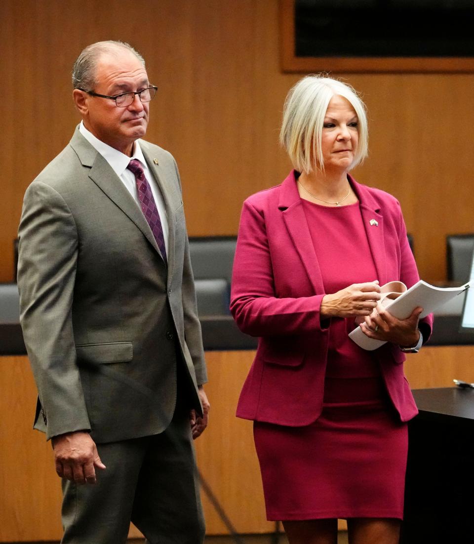 Michael Ward (left) and his wife Kelli Ward appear with their attorney (right) for their arraignment in Maricopa County Superior Court in Phoenix on May 21, 2024. Michael Ward and Kelli Ward are among those charged in a conspiracy stemming from the 2020 election.