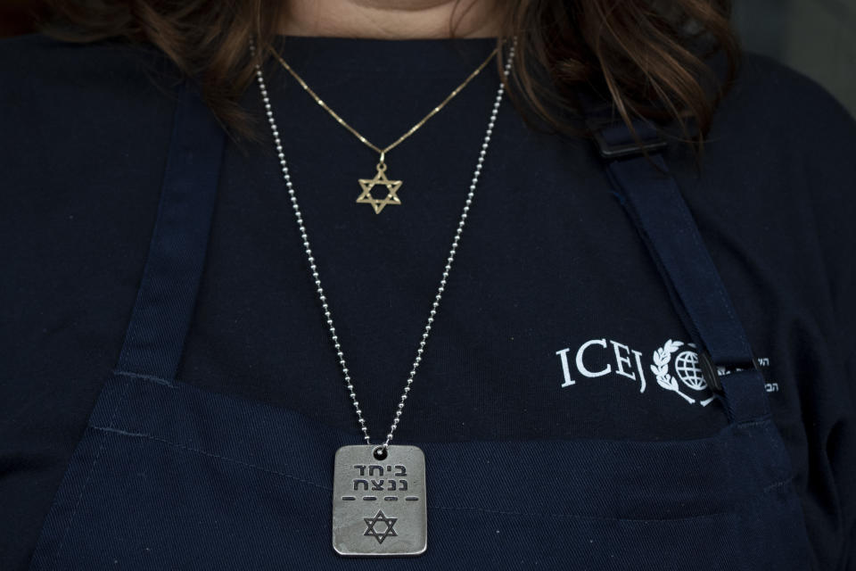 Elisabeth Odegaard poses for a portrait with necklaces as she prepares food for Israeli soldiers on a brief respite from combat operations in the Gaza Strip, in Tel Aviv, Wednesday, March 6, 2024. Her visit to Israel is part of a wave of religious "voluntourism" to Israel, organized trips that include some kind of volunteering aspect connected to the ongoing war in Gaza. Israel's Tourism Ministry estimates around a third to half of the approximately 3,000 visitors expected to arrive each day in March are part of faith-based volunteer trips. Prior to Oct. 7, around 15,000 visitors were arriving in Israel per day, according to Tourism Ministry statistics. (AP Photo/Maya Alleruzzo)