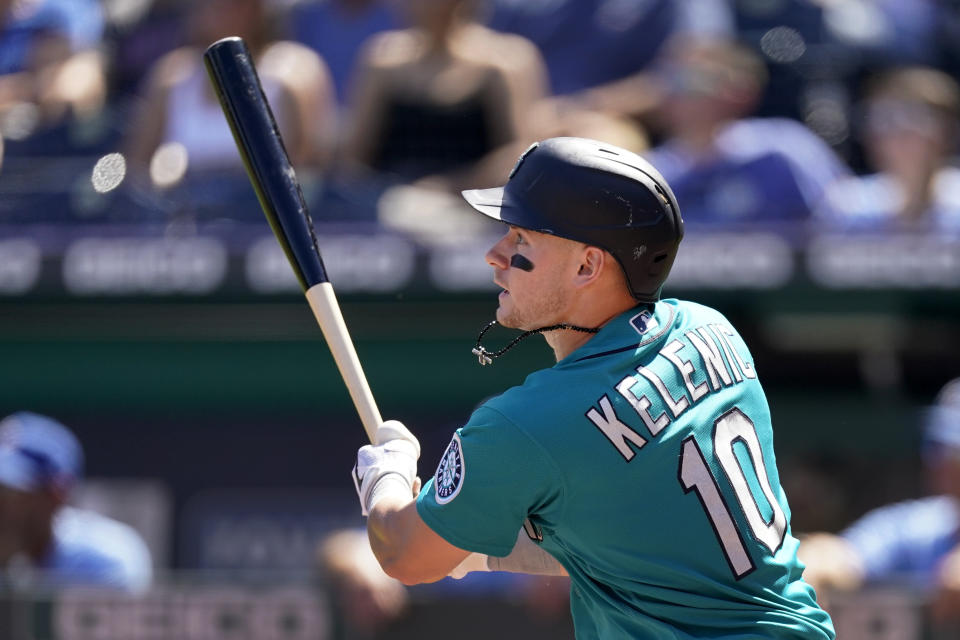 Seattle Mariners' Jarred Kelenic hits a two-run double during the first inning of a baseball game against the Kansas City Royals Sunday, Sept. 19, 2021, in Kansas City, Mo. (AP Photo/Charlie Riedel)