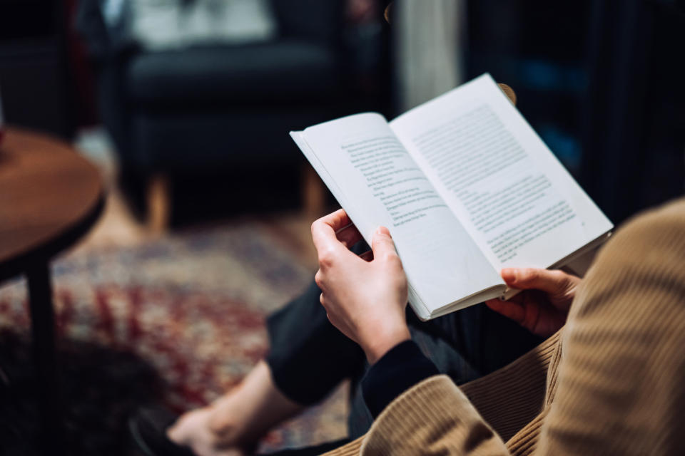 hands holding a book