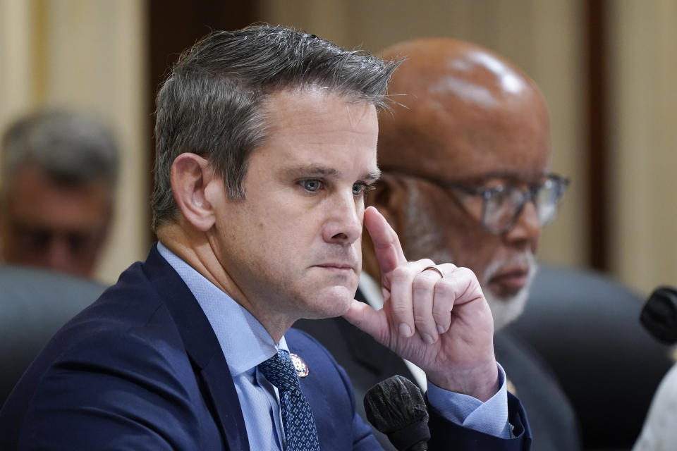 Rep. Adam Kinzinger, R-Ill., left, and Chairman Bennie Thompson, D-Miss., listen as the House select committee investigating the Jan. 6 attack on the U.S. Capitol continues to reveal its findings of a year-long investigation, at the Capitol in Washington, Thursday, June 23, 2022. (AP Photo/J. Scott Applewhite)