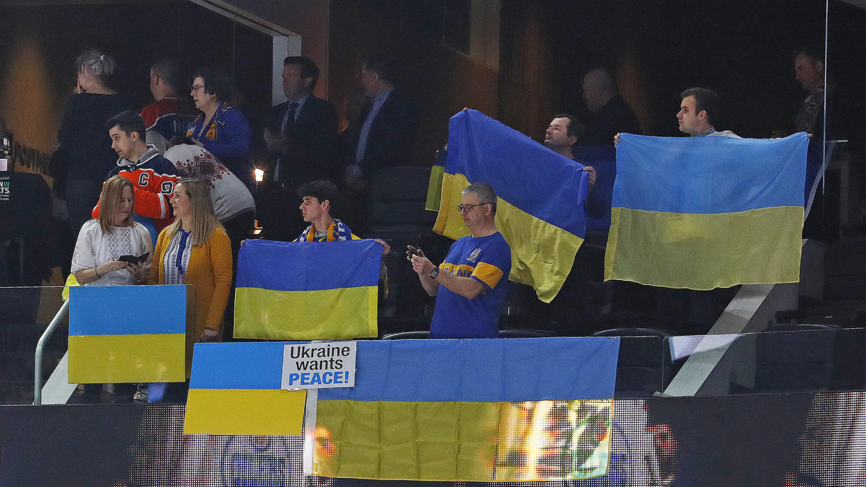 Edmonton Oilers fans wave Ukrainian flags prior to a game against the Washington Capitals. (Perry Nelson-USA TODAY Sports)