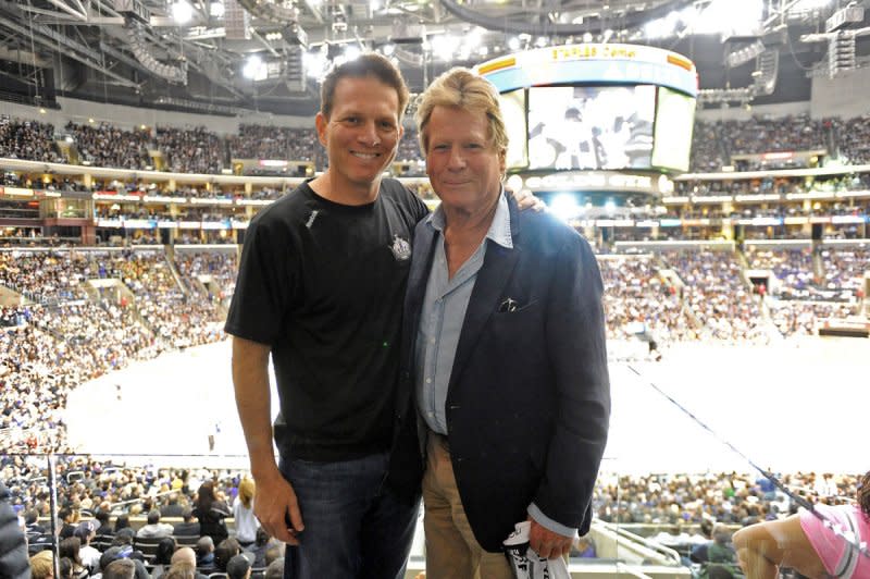 Patrick (L) and Ryan O'Neal iattend Game 4 of the NHL Western Conference first-round playoff series between the Vancouver Canucks and Los Angeles Kings at Staples Center in Los Angeles in 2012. File Photo by Jayne Kamin-Oncea/UPI