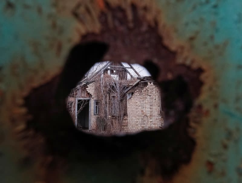 House damaged by shelling is seen in the village of Zaitseve