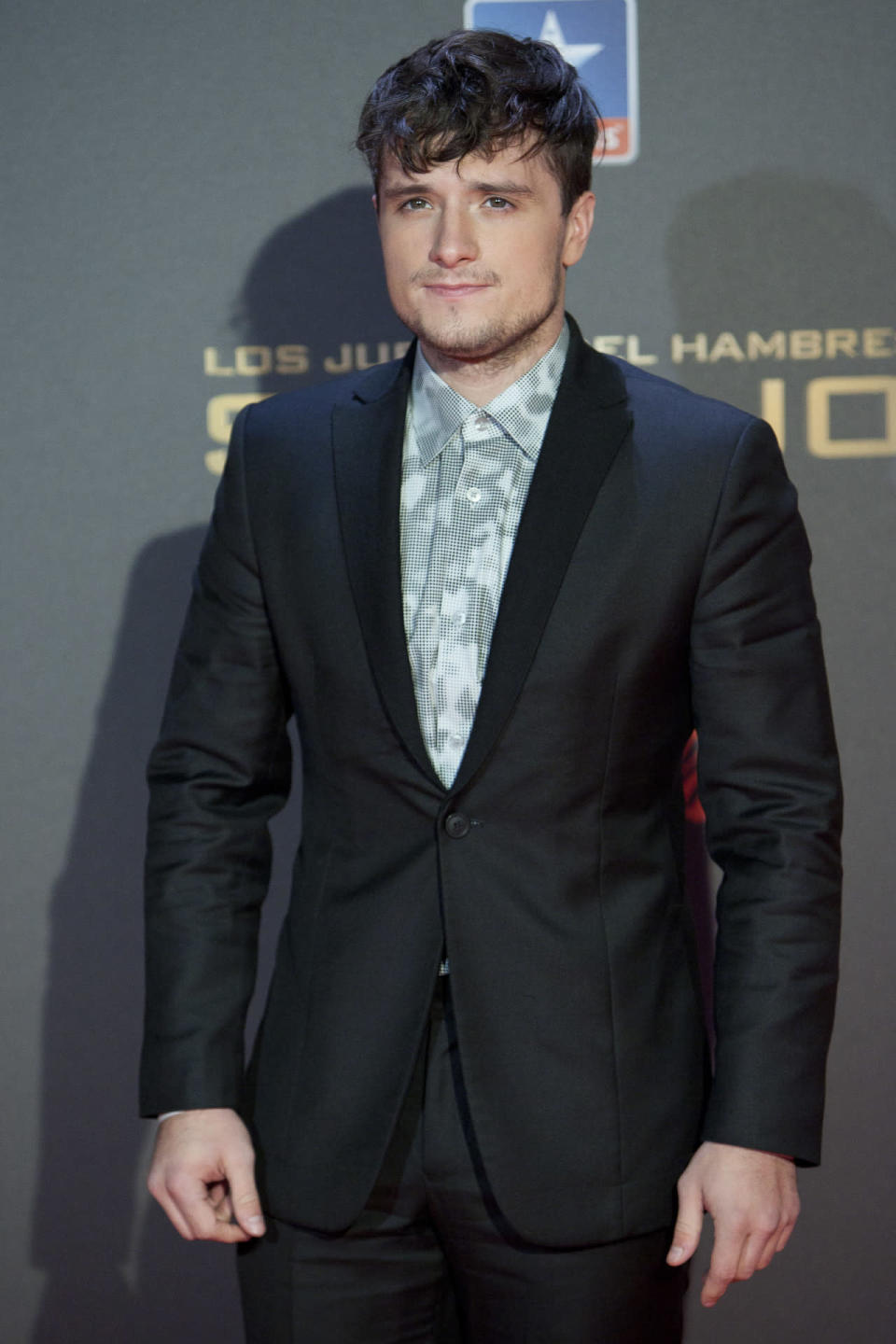 Josh Hutcherson in a camouflage button down shirt at the premiere of “The Hunger Games: Mockingjay - Part 2″ in Madrid, Spain. 