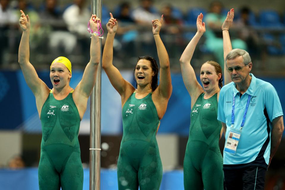 Blair Evans, center, is flanked by Kylie Palmer, left, and Bronte Barratt after winning the gold medal in the women's 4x200m freestyle final at the Dr. S.P. Mukherjee Aquatics Complex during the Delhi 2010 Commonwealth Games on Oct. 6, 2010, in Delhi, India. (Photo by Matt King/Getty Images)