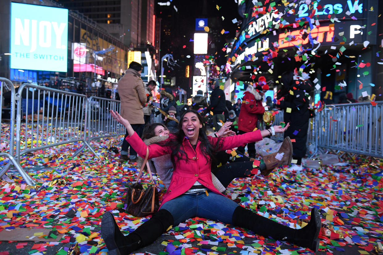 Revelers play in confetti in Times Square during the New Year celebrations in Manhattan, New York, U.S., January 1, 2018.