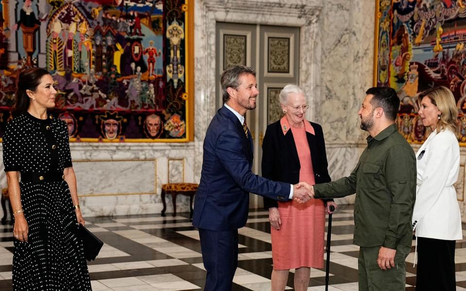 Ukrainian President Volodymyr Zelensky (right) and his wife Ukrainian President Volodymyr Zelensky (right) are received by Prince Frederik and Queen Margrethe II in August (AFP via Getty)