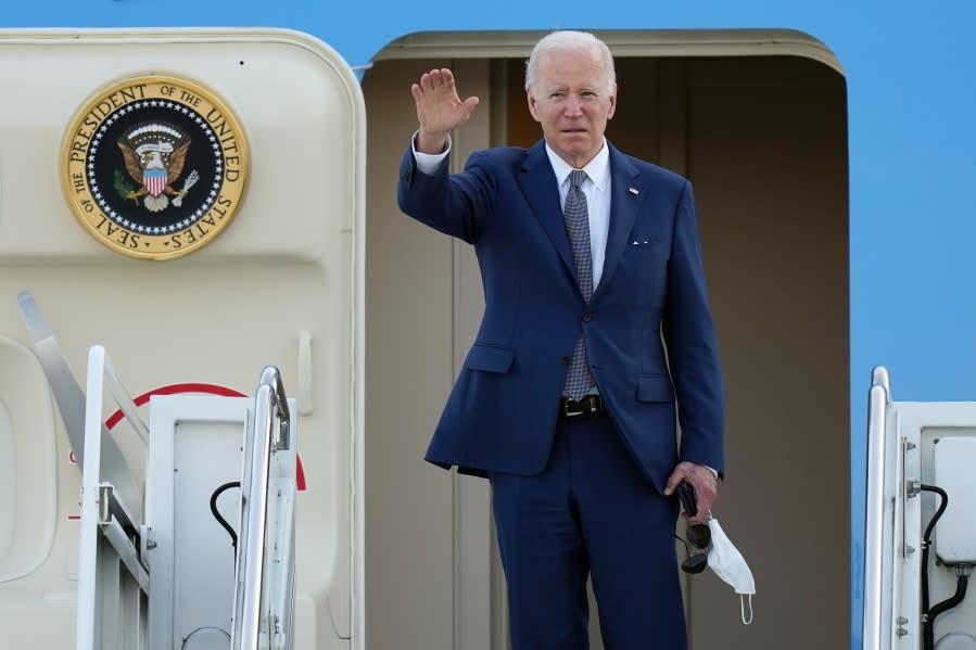 U.S. President Joe Biden waves as he boards Air Force One at Yokota Air Base in Fussa, Japan, Tuesday, May 24, 2022. (AP Photo/Eugene Hoshiko)