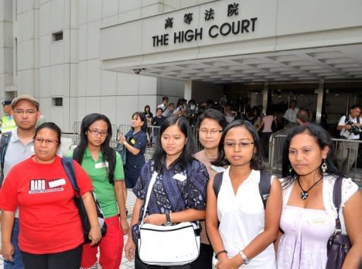 Filipina and Indonesian Migrant Workers' Union members leave the High Court -- in support of Evangeline Banao Vallejos, a Filipina maid who has lived and worked in Hong Kong since 1986. A Hong Kong court has ruled that a law banning foreign maids from permanent residency is unconstitutional in a landmark case that could pave the way for a flood of applications