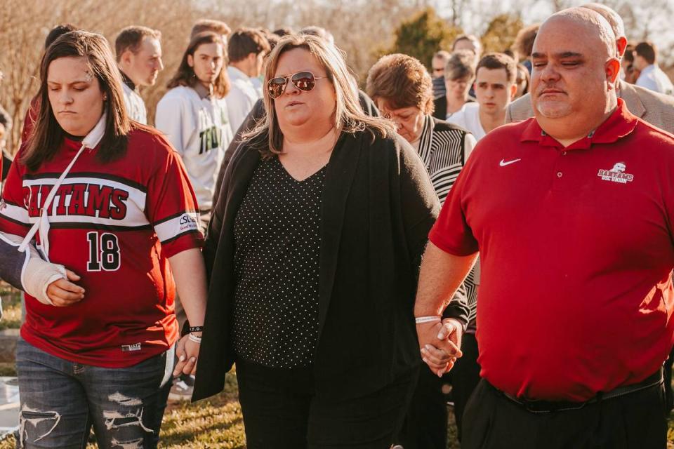 The Stokes family mourns at the funeral of Mia Stokes on Feb. 14 2020. Mia Stokes was killed in a car crash by an allegedly drunk driver in 2020. From left to right is Mallory Stokes (Mia’s twin sister, wearing a cast due to her own injuries in the wreck), mother Holly Stokes and father Eric Stokes.