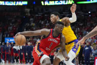 New Orleans Pelicans forward Zion Williamson (1) drives to the basket against Los Angeles Lakers forward Rui Hachimura in the second half of an NBA basketball play-in tournament game Tuesday, April 16, 2024, in New Orleans. The Lakers won 110-106. (AP Photo/Gerald Herbert)