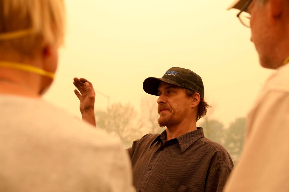 Chris Tofte directs volunteers on how to get to his house to continue searching for his son Wyatt Tofte,13, and his dog Duke in Stayton, Oregon on Wednesday, Sept. 9, 2020.